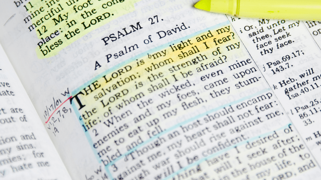 Bible open on Psalm 27 with annotations and highlight.